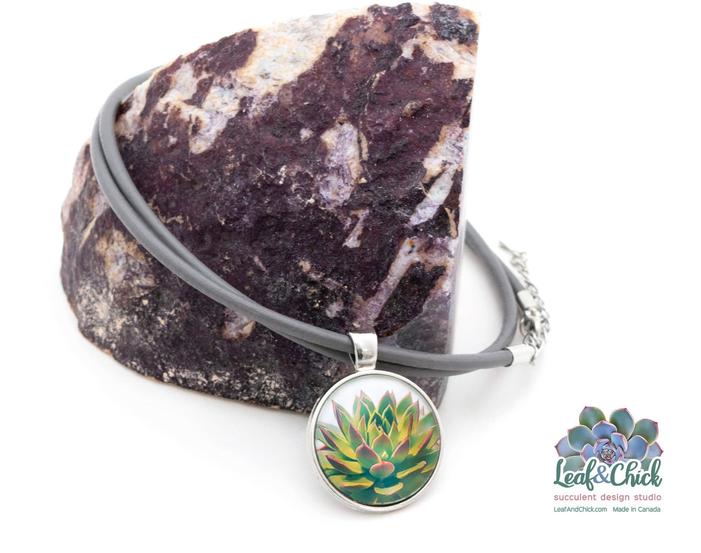 succulent art necklace on grey leather