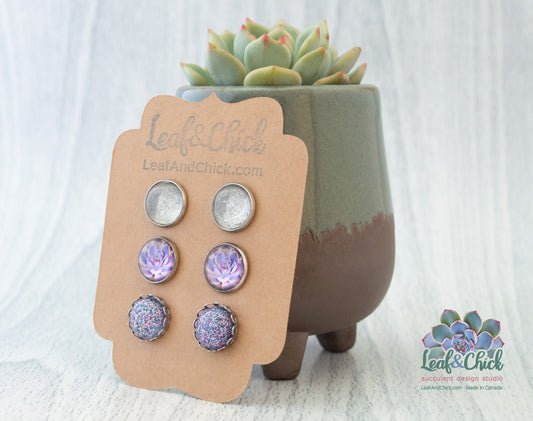 a set of three stud earrings set in a stainless steel base with a purple theme