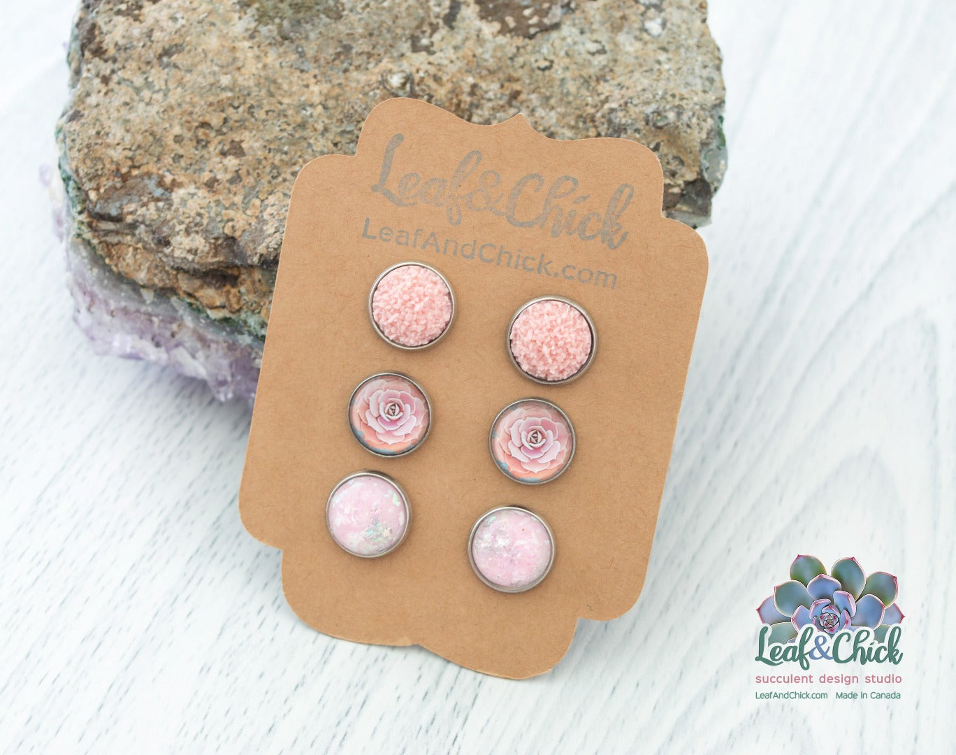 a trio of studs in pinks