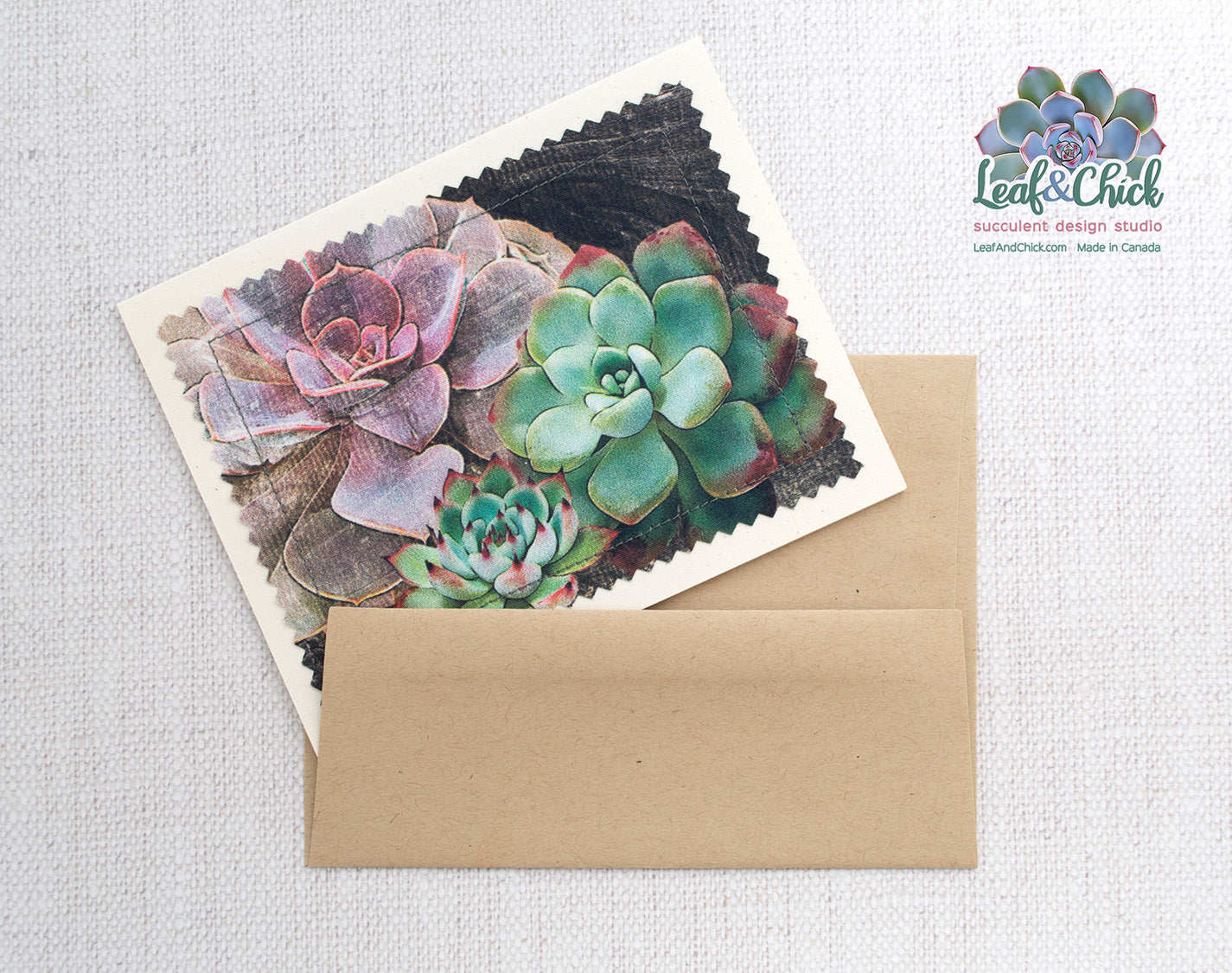 three succulents on a dark wood background printed on fabric and sewn onto a greeting card