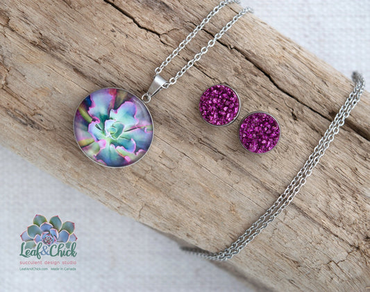 A stainless steel art necklace featuring purples and blues