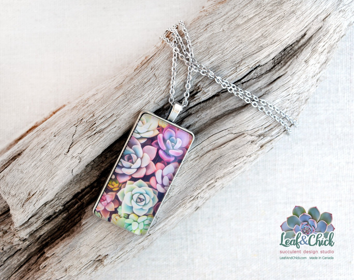 colourful succulent art under glass in a necklace