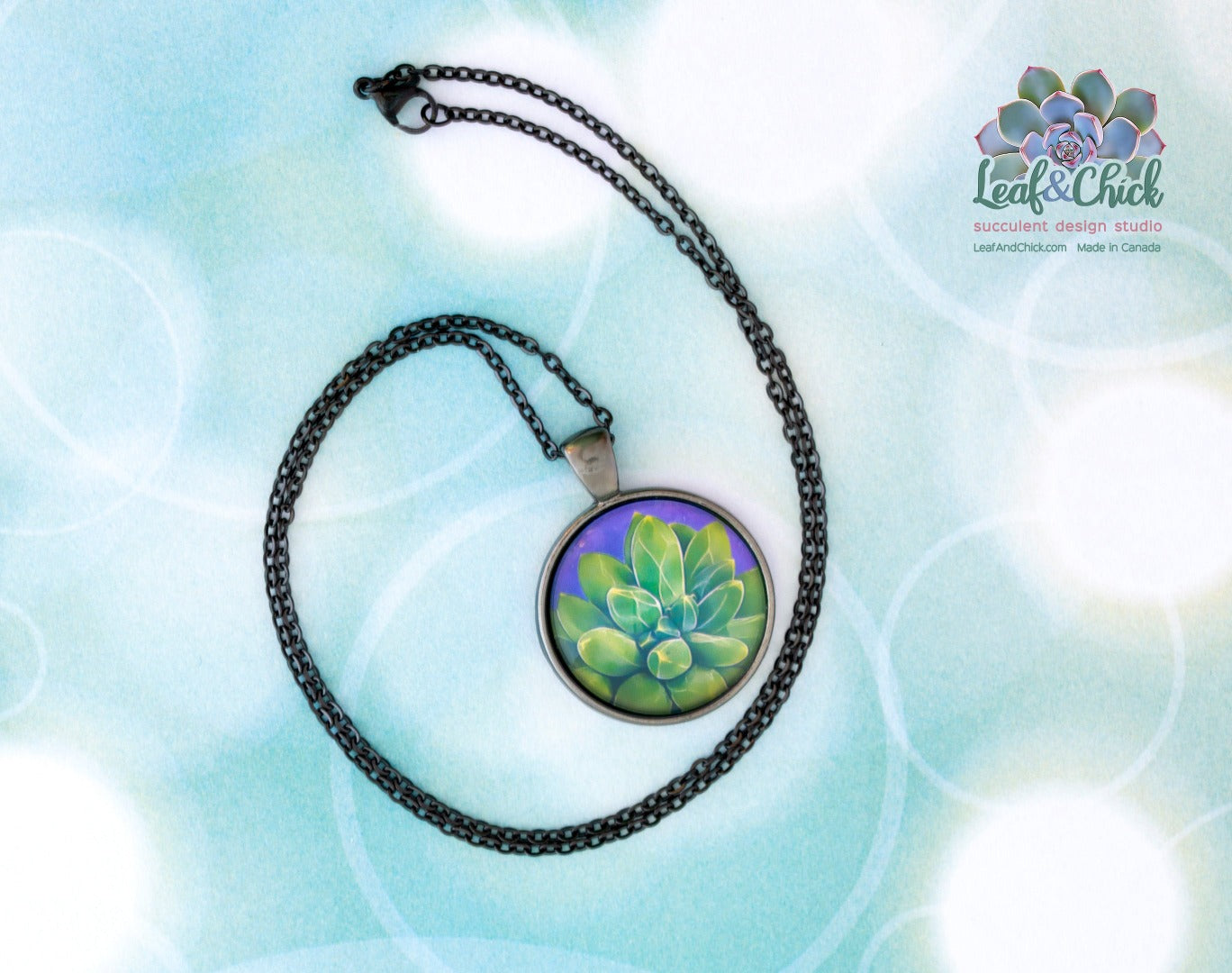 green succulent art on a black stainless steel chain