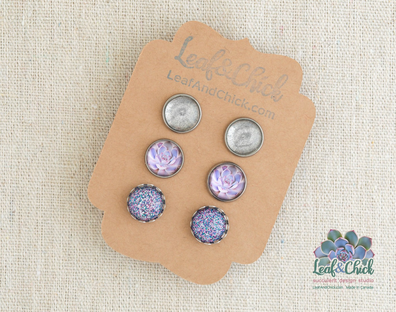 purple succulent art earrings with a clear sparkle pair and a chunky purple glitter pair