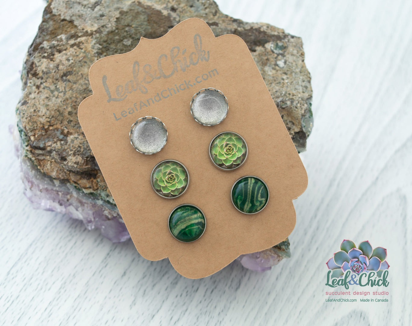 three pairs of earrings in sparkles and greens