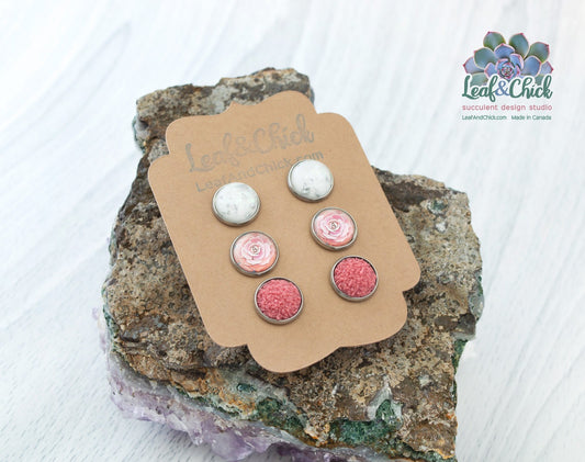 set of three stud earrings in pinks and sparkles