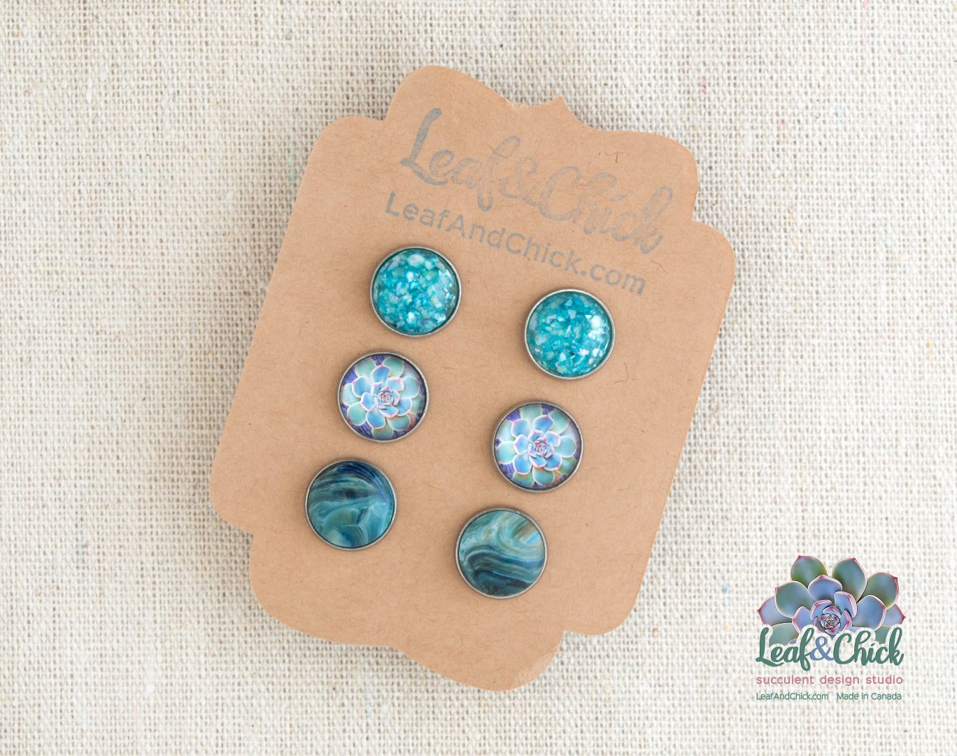 3 pairs of stud earrings in shades of blue