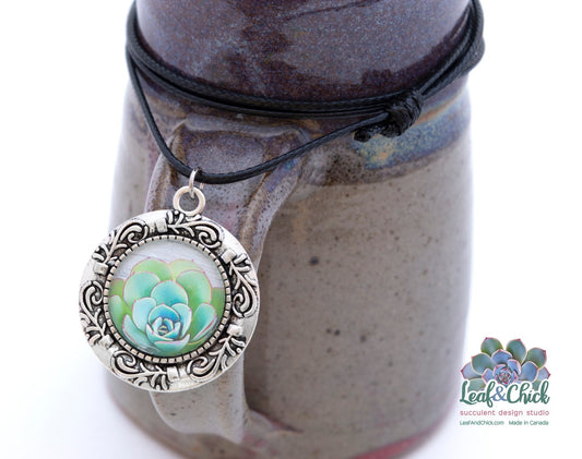 close up of succulent pendant with stylized echeveria in an ornamental setting